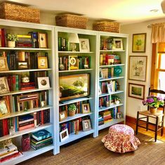 there are many books on this bookcase in the living room and it is full of books