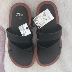 Never Been Worn! Brand New. Https://Www.Zara.Com/Us/En/Minimal-Flat-Sandals-P13603910.Html?V1=144395239 Chunky Minimalist Style Slide Sandals With Crossed Straps. Starfit. Flexible Technical Sole Made Of Polyurethane Foam Designed To Offer Increased Comfort. Sole Height: 0.8 Inches (2 Cm) Brown Flat Footbed Sandals For Beach, Zara Black Sandals For Vacation, Brown Flat Heel Slides For Beach, Brown Flat Heel Beach Slides, Brown Flat Heel Slides For The Beach, Zara Black Sandals For Summer, Summer Brown Flip Flops With Textured Footbed, Zara Sandals With Round Toe For Beach, Zara Beach Sandals