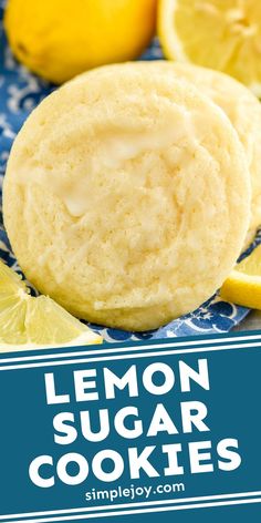 lemon sugar cookies on a blue and white plate with lemons in the background text reads, lemon sugar cookies