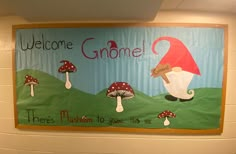 a welcome gnome sign hangs on the wall in front of a school hallway door decorated with mushrooms