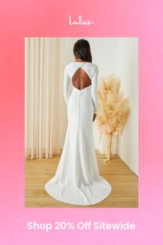 Make your special day even more so by making sure you walk down the aisle in the Lulus Eloquent Endearment White Long Sleeve Backless Maxi Dress! Stretchy crepe knit shapes this gorgeous dress that starts with a princess-seamed bodice, a crew neckline, and elegant long sleeves. The fitted waist tops an ultra-flattering, mermaid maxi skirt that boasts a romantic train at the back. A diagonal row of functional buttons secure above the flirty backless design, while a hidden zipper/clasp sits beneath a row of decorative buttons. Fit: This garment fits true to size. Length: Floor length. Size medium measures 60.5" from shoulder to hem. Bust: Great for any cup size. Waist: Fitted - very fitted at natural waist. Hip: Fitted - stretchy fabric allows room for hips. Undergarments: May be worn with a Fitted Dress With Sheer Back For Wedding Night, Wedding Gown With Flattering Silhouette And Fitted Bodice, Chic Wedding Dress With Cutout Back, Chic Wedding Dress With Keyhole Back, Fitted Wedding Dress With Keyhole Back, Backless Dresses With Cutout Back For Wedding, White Wedding Dress With Flattering Silhouette, Backless Wedding Dress With Cutout Back, Elegant Wedding Dress With Sheer Back