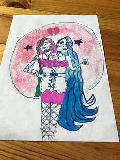 a drawing of two women hugging each other on top of a piece of white paper