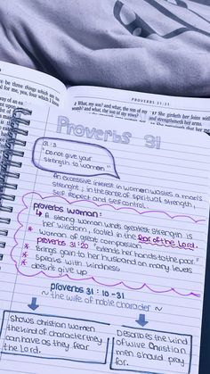 an open notebook with the words provers 31 written in purple ink on top of it