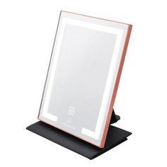 an electronic device with a light up mirror on it's stand in front of a white background