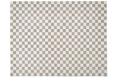 a checkered rug with grey and white squares on it, against a white background