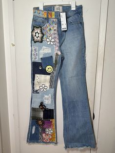 Add a unique touch to your wardrobe with these BDG Urban Outfitters women's patchwork studs flare jeans in size 24. The jeans are made of 100% cotton and feature a medium wash with belt loops and a button closure. The 5-pocket design includes fringe, embroidered, and sequin accents, making them a perfect choice for any occasion. The distressed details add a vintage feel to the straight style, which is perfect for any fashion-forward woman. The garment care instructions are dry clean only. Thrift Flips, Bdg Urban Outfitters, Urban Outfitters Women, Pocket Design, Flare Jeans, Fashion Forward, Urban Outfitters, Care Instructions, Jeans Size