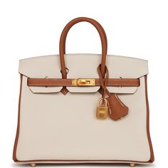 This Birkin is in Gold and Craie togo leather with brushed gold hardware and has tonal and contrast stitching, front flap, two straps with center toggle closure, clochette with lock and two keys, and double rolled handles.The interior is lined with Gold chevre and has one zip pocket with an Hermes engraved zipper pull and an open pocket on the opposite side. Collection: ZOrigin: FranceCondition: Pristine; new or never worn (plastic on hardware)Accompanied by: Hermes box, Hermes dustbag, clochett