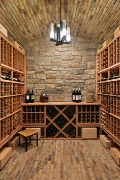 a wine cellar with wooden shelves filled with bottles