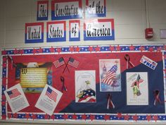 a bulletin board with american flags and pictures on it