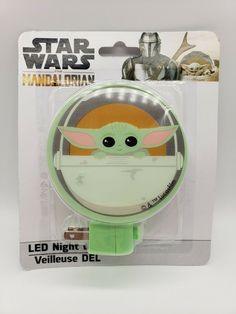 the child yoda light is on display in a card package for $ 3 99