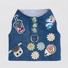 a denim vest with patches on it