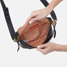 This statement-making belt bag has tassel zipper straps and a beautiful leather and chain detail for a luxe look. Trendy Belts, Leather Belt Bag, Hobo Handbags, Black Belt, Belt Bag, Pebbled Leather, Leather Belt, Suede Leather, Zip Pockets