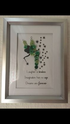 a white frame with some green beads on it and a quote in the middle that says i