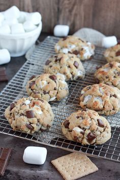 chocolate chip cookies cooling on a wire rack with marshmallows