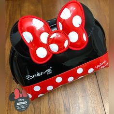 Disney X The Crme Shop Safely Store Your Everyday Essentials With This Charming Makeup Pouch! Minnie Mouse Ears, Bow, Red And White Polka Dot Base, And Signature In High Shine Material. Lined With Black Fabric. Approximately 9 Inches Long, 7 Inches Tall, 4 Inches Deep Cute Mickey Mouse Bags For Gifts, Cute Mickey Mouse Bags As Gift, Red Minnie Mouse Bag For Gift, Cute Red Bag For Disney Trips, Cute Red Minnie Mouse Bag, Trendy Red Bags For Disney Trips, Disney Minnie Mouse Red Bags, Red Minnie Mouse Bag For Daily Use, Cute Black Mickey Mouse Bags