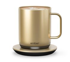 an ember coffee mug on a saucer with the lid open and its base in gold