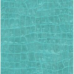 the texture of an alligator skin pattern in turquoise green