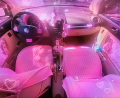 the interior of a car with pink leather seats and heart - shaped decorations on the dash