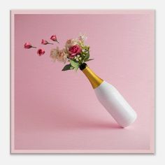 a vase with flowers in it on a pink background