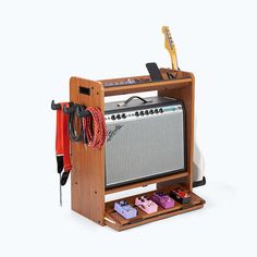 an old fashioned guitar amp with some accessories