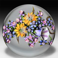 a glass plate with flowers painted on it