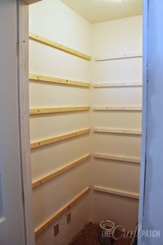 an empty closet with shelves in it