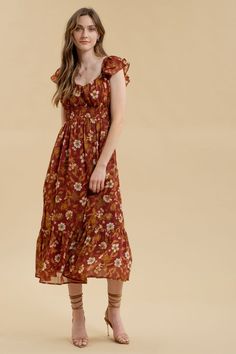 Expertly designed with a sweetheart neckline and double ruffled sleeves, the Carmela Floral Midi Dress is a must-have for any fashion-forward individual. The ruched bust and smocked underbust provide a flattering silhouette, while the lined, floral print fabric adds a touch of elegance. Perfect for all occasions. 100% Polyester Casual Midi Dress With Ruffled Fitted Bodice, Flowy Smocked Dress With Ruffles And Empire Waist, Bohemian Dress With Smocked Bodice And Ruffled Straps, Casual Midi Dress With Sweetheart Neckline And Ruched Detail, Fitted Midi Dress With Smocked Bodice And Ruffled Straps, Casual Ruffle Dress With Sweetheart Neckline, Fitted Brown Smocked Dress With Ruffles, Brown Square Neck Dresses With Ruffles, Brown Square Neck Dress With Smocked Back