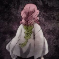 the back of a person with pink hair and braids on their head, standing in front of a dark background