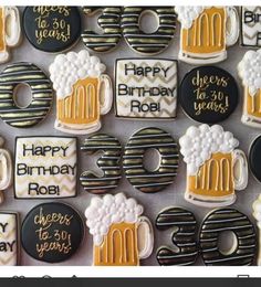 decorated birthday cookies with beer and pretzels on them for 30th birthday party or celebration