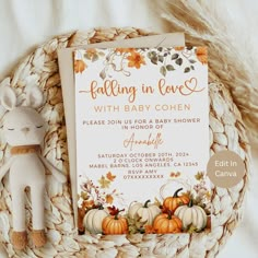 a baby shower with pumpkins and fall leaves