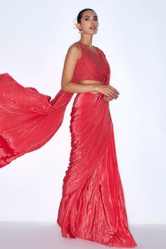 Red pre draped saree with sequin embroidery. Comes with padded cutdana embroidered blouse. 
Components: 2
Pattern: Embroidered
Type Of Work: Cutdana
Neckline: One Shoulder
Sleeve Type: Sleeveless
Fabric: Silk crepe, Lining: Shantoon
Color: Red
Other Details: 
Attached lining
Model Height: 6ft wearing size XS
Length: Saree: 45 inches
Closure: Blouse: Back hook, drawstring
Occasion: Sangeet,Mehendi and Haldi - Aza Fashions Red Pre-draped Saree For Party, Draped Blouse Piece For Evening Festivals, Party Saree With Cutdana And Draped Style, Draped Saree For Evening Festivals, Draped Saree For Party And Navratri, Draped Choli For Evening Festivals, Evening Saree For Festivals, Draped Style, Evening Saree For Festivals, Evening Festive Draped Choli