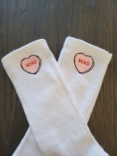 Candy conversation heart is embroidered with the XOXO saying. This is on a plain white  crew sock. UNISEX SIZING. SIZE M(6-10 WOMEN, 8-10 MEN)  SIZE L +  Rep these for valentine's day, or make the perfect gift to pair with some sneakers! Reach out if you have any additional questions. Cute White Socks With Letter Print, White Cotton Socks For Gifts, White Cotton Socks As Gift, White Cotton Socks As A Gift, Socks With Hearts, Valentine Socks, Valentines Basket, Valentines Socks, Socks Aesthetic