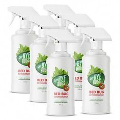 six bottles of bed bug extermina with white foam on the top and green leaves