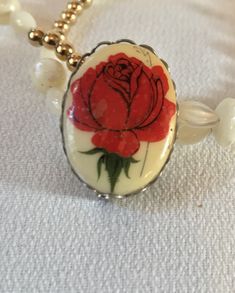 Tiny Vintage porcelain ceramic Red Rose Floral Decal Transfer Pin In excellent condition - straight from a grandma's jewelry box 💖 Will gift nicely 🎀 www.mysoulrepair.com Vintage Rose Brooches For Gifts, Vintage Rose Brooch For Gift, Vintage Rose Brooches As Gift, Vintage Cream Flower Jewelry, Vintage Rose Brooch Jewelry, Vintage Rose Jewelry With Brooch, Vintage Rose Brooch, Victorian Cream Jewelry Gift, Victorian Style Cream Jewelry Gift