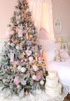 a flocked Christmas tree decorated with blush and pink ornaments, white snowflakes and stars and some paper decor Tree Themes, Pink Christmas Decorations, Shabby Chic Christmas