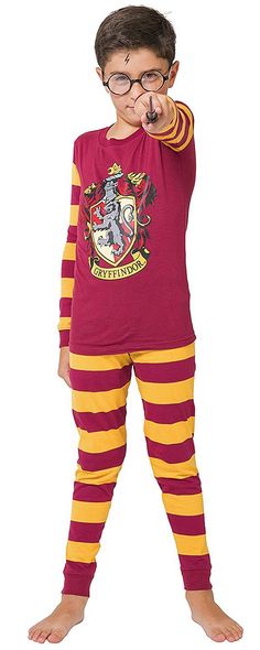 a young boy in harry potter pajamas pointing at the camera