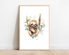 a watercolor painting of a sloth hanging from a tree branch with leaves on it