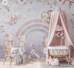 a baby's room with a canopy bed and wallpaper that has pink flowers on it