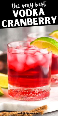 the very best vodka cranberry cocktail in a glass with lime wedges and crackers