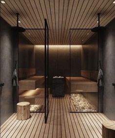 an indoor sauna with wooden floors and benches