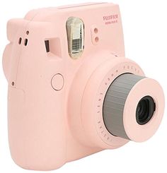 a pink camera is shown with the lens up to its front and side facings