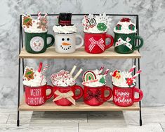 christmas themed mugs are displayed on three shelves