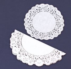 two white doily on a blue background