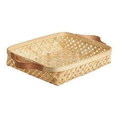 a woven basket with leather handles is shown on a white background for use as a serving tray