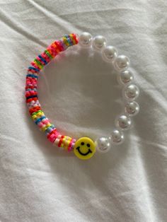 a beaded bracelet with a smiley face on it