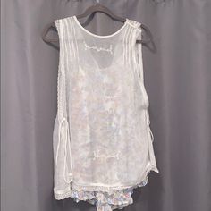 Free People Fancy Tank Top Blouse. Floral Shirt Underneath A Sheer Top. The Sides Tie And Are Flown With Openings. Never Worn Before. Size Xs. Spring Vacation Tops With Sheer Details, Spring Vacation Sheer Tops, Summer Floral Print Blouse For Loungewear, Floral Print Summer Blouse For Loungewear, Sheer Sleeveless Blouse For Spring, Summer Blouse With Lace Trim For Daywear, Feminine Sheer Tops For Daywear, Sheer Short Sleeve Vacation Tops, Sheer Short Sleeve Tops For Vacation