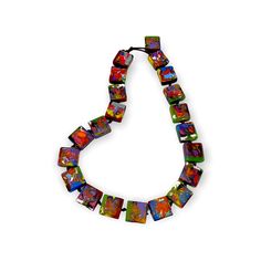 Beaded necklace with a colorful marbled design 12"L, brown cord Made from clear and colored resin Note: Each piece is handmade and one-of-a-kind. Patterns and coloring will vary Free shipping! Designed in South Florida and made in Brazil. Multicolor Recycled Glass Bead Jewelry, Handmade Multicolor Necklaces From Recycled Glass, Adjustable Multicolor Hand Painted Necklace, Multicolor Recycled Glass Jewelry With Large Beads, Multicolor Recycled Glass Beaded Jewelry, Artistic Adjustable Necklace With Colorful Beads, Adjustable Multicolor Czech Glass Necklace, Multicolor Recycled Glass Beads For Jewelry Making, Multicolor Beaded Rectangular Necklace