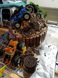 a cake made to look like a monster truck with oreo cookies on the side