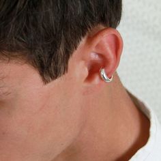 Simple sterling silver ear cuff.  This elegant ear cuff features a sleek minimalist shape that narrows at the one end, creating a sophisticated and contemporary look. A testament to refined simplicity and timeless style. Simply slide it onto the edge of your ear for an instant touch of minimalist chic. Wear it alone for a subtle statement or combine it with other cuffs for a bolder layered look. *  No piercing needed  *  Hypoallergenic  * Material: solid 925 sterling silver 📐DIMENSIONS thickest Silver Huggie Ear Cuff For Everyday Wear, Everyday Silver Huggie Ear Cuff, Classic Silver Ear Cuff For Pierced Ears, Silver Nickel-free Huggie Ear Cuff, Silver Minimalist Clip-on Ear Cuff, Nickel-free Silver Huggie Ear Cuff, Silver Single Huggie Ear Climber, Silver Huggie Ear Climber Single Earring, Silver Huggie Ear Cuff With Ear Wire