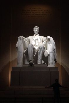 the lincoln memorial is lit up at night with its lights on and it's white